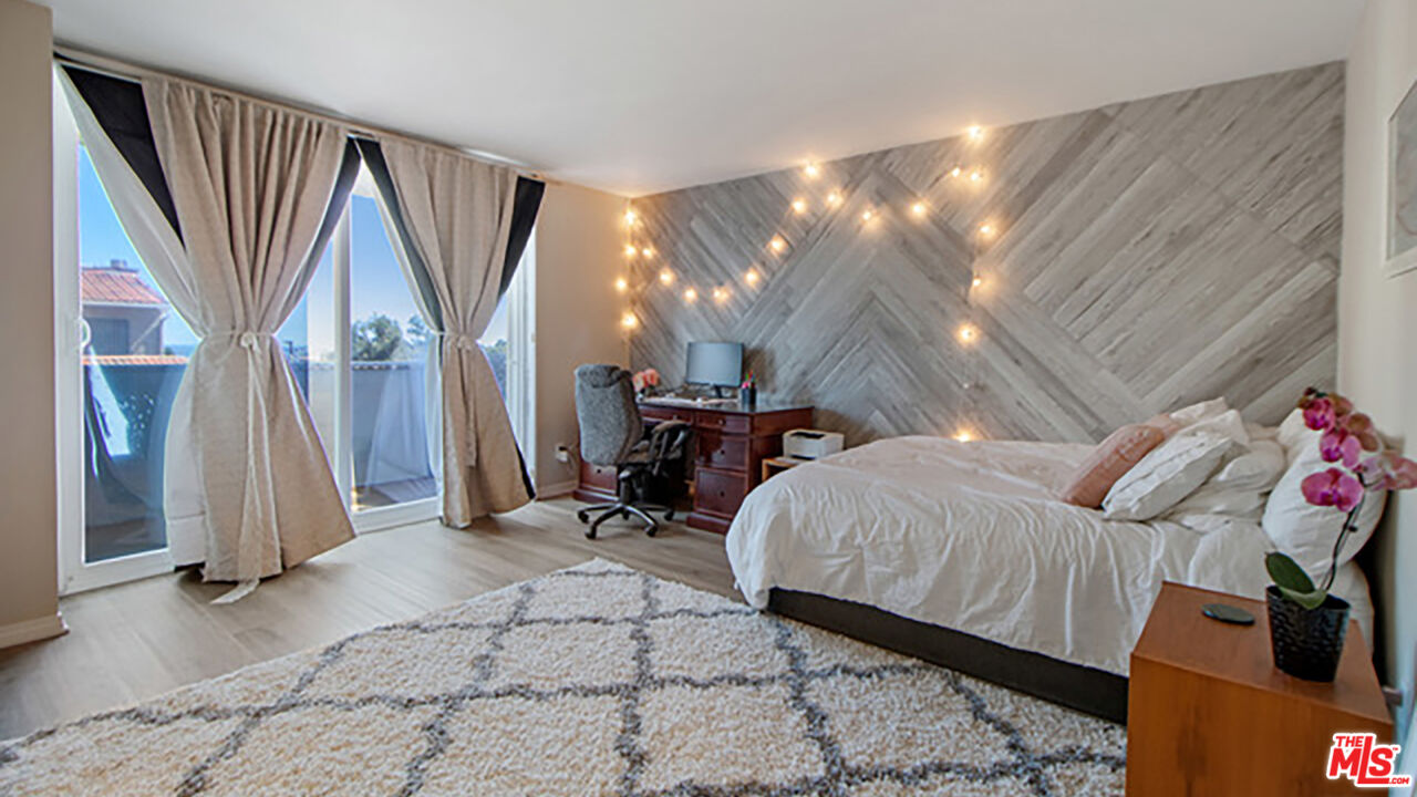 28286 Rey De Copas Lane Malibu, CA 90265 - Photo 14 of 26 a bed room with a bed and a couch