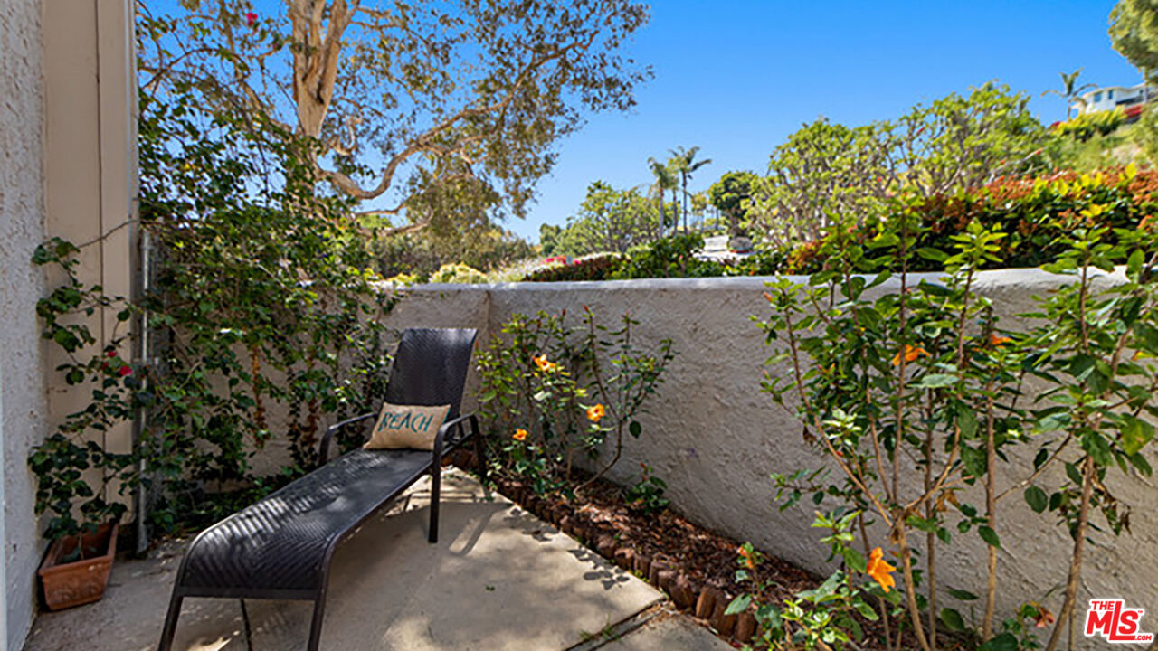 28286 Rey De Copas Lane Malibu, CA 90265 - Photo 18 of 26 an outdoor sitting area with a tree