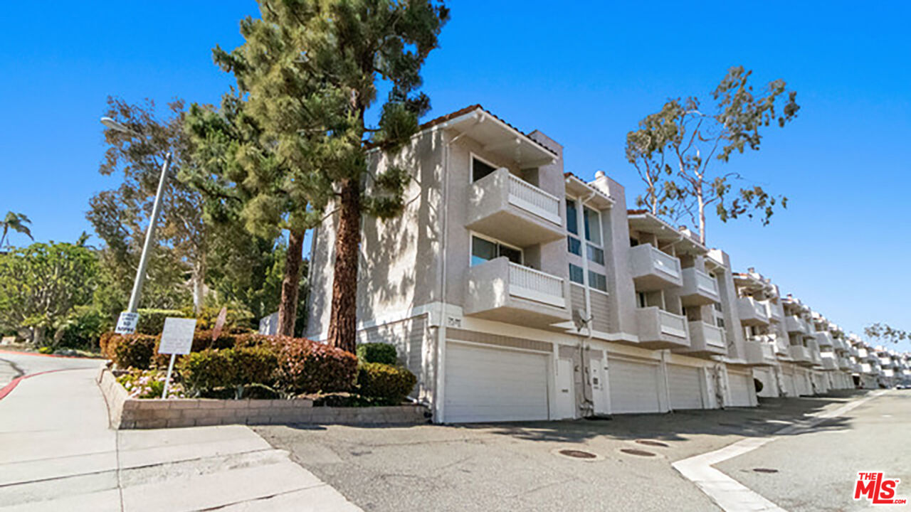 28286 Rey De Copas Lane Malibu, CA 90265 - Photo 24 of 26 a view of a street with potted plants and large trees