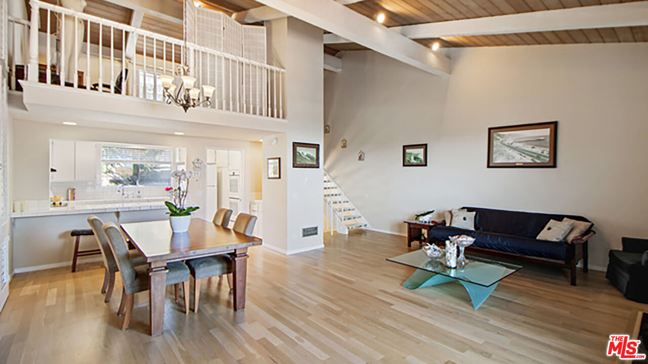 28286 Rey De Copas Lane Malibu, CA 90265 - Photo 3 of 26 a living room with furniture and a wooden floor