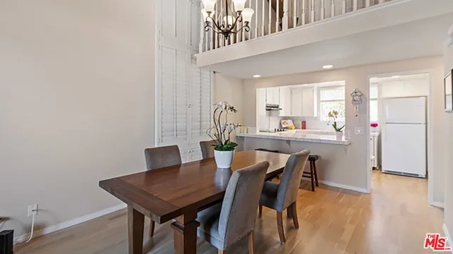 a kitchen with a table and chairs