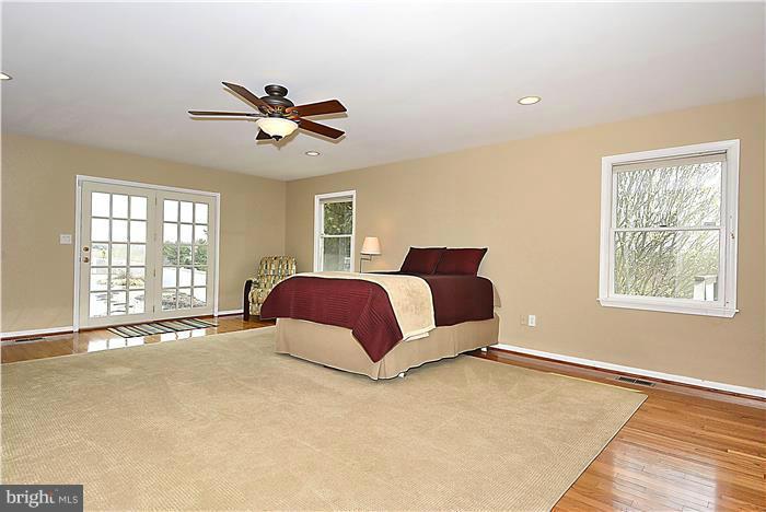2201 Corbett Road Monkton, MD 21111 - Photo 14 of 30 a bedroom with a large bed and a window
