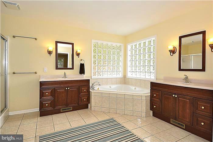2201 Corbett Road Monkton, MD 21111 - Photo 15 of 30 a spacious bathroom with a tub sink shower and mirror