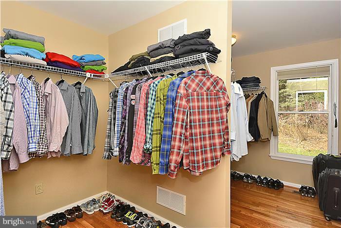 2201 Corbett Road Monkton, MD 21111 - Photo 16 of 30 a view of walk in closet with clothes and shoes