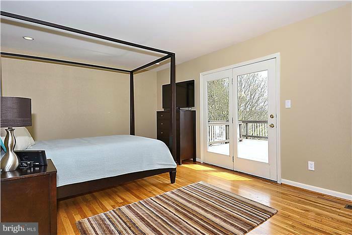 2201 Corbett Road Monkton, MD 21111 - Photo 17 of 30 a bedroom with a bed and wooden floor