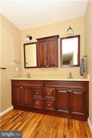 2201 Corbett Road Monkton, MD 21111 - Photo 18 of 30 a bathroom with a sink and a mirror