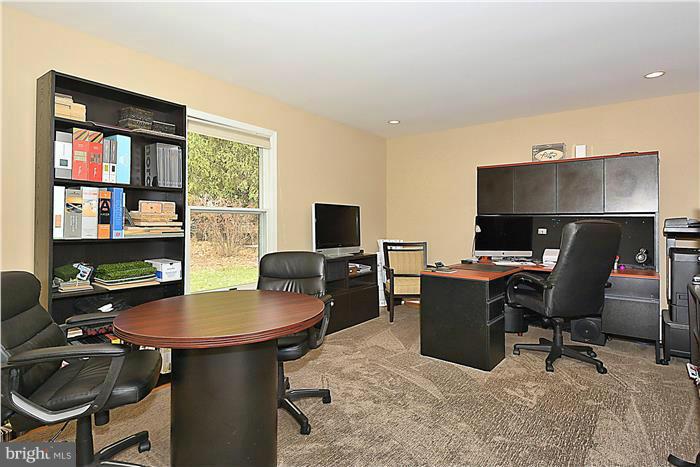 2201 Corbett Road Monkton, MD 21111 - Photo 19 of 30 a work room with furniture a flat screen tv and a window