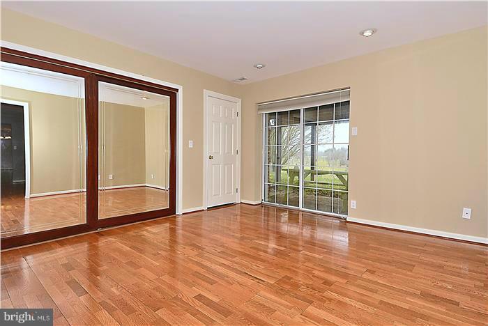 2201 Corbett Road Monkton, MD 21111 - Photo 20 of 30 an empty room with wooden floor and windows
