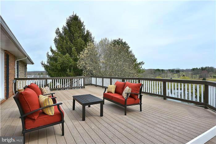 2201 Corbett Road Monkton, MD 21111 - Photo 3 of 30 a balcony with wooden floor and outdoor seating