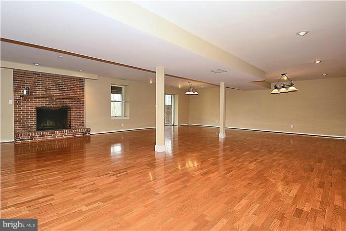 2201 Corbett Road Monkton, MD 21111 - Photo 23 of 30 a view of empty room with wooden floor and fireplace
