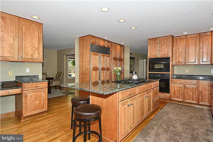 2201 Corbett Road Monkton, MD 21111 - Photo 9 of 30 a kitchen with stainless steel appliances granite countertop a stove a sink and a refrigerator