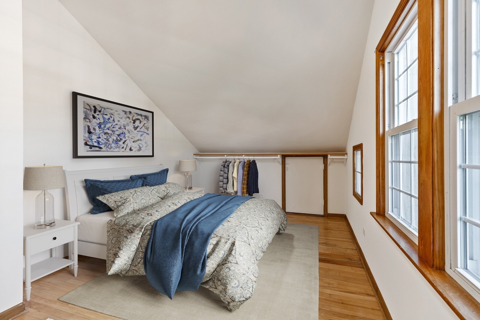 305 Olmsted Road Riverside, IL 60546 - Photo 12 of 33 a bedroom with a large bed and a large window