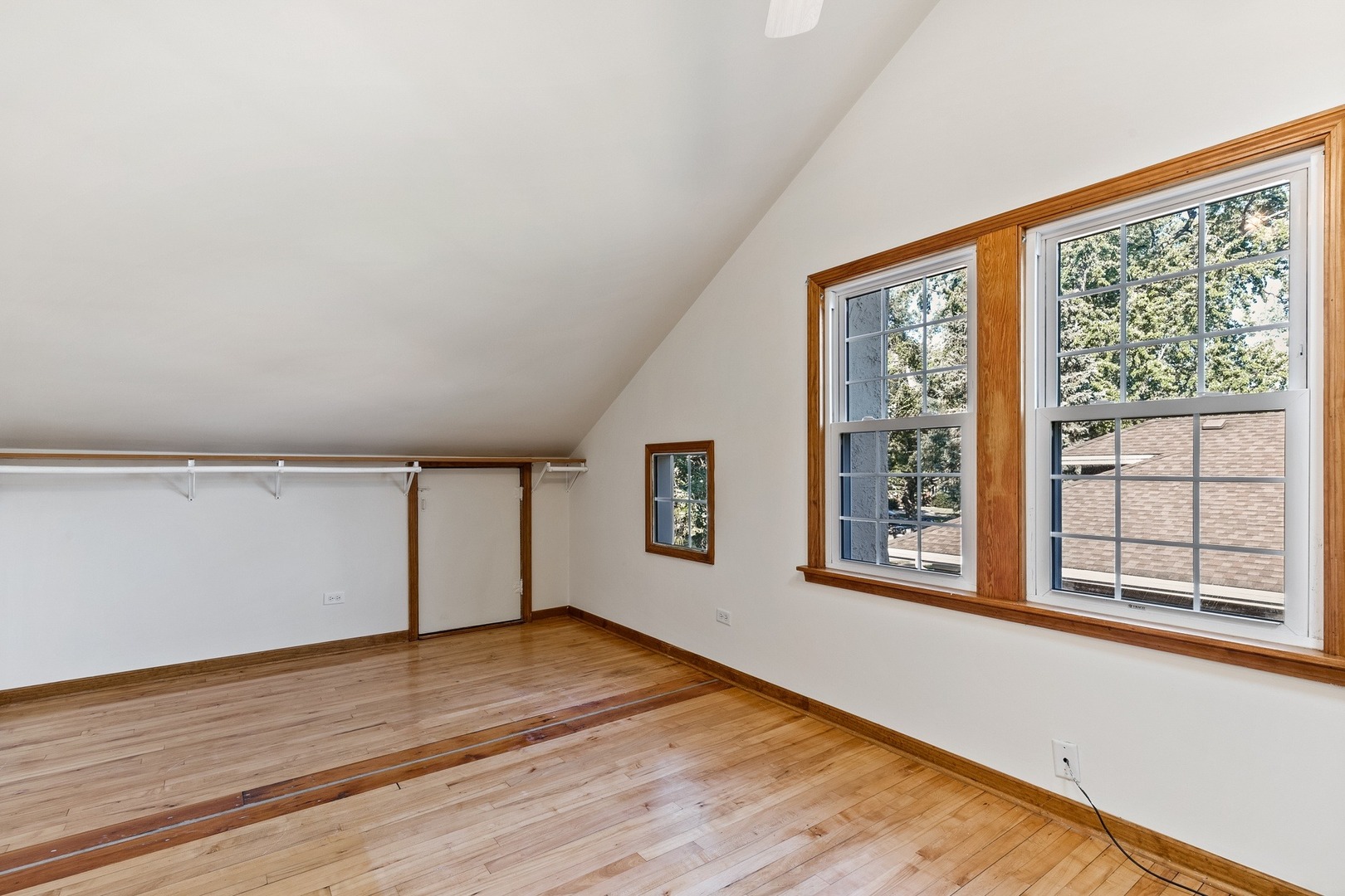 305 Olmsted Road Riverside, IL 60546 - Photo 14 of 33 a view of empty room with wooden floor and fan