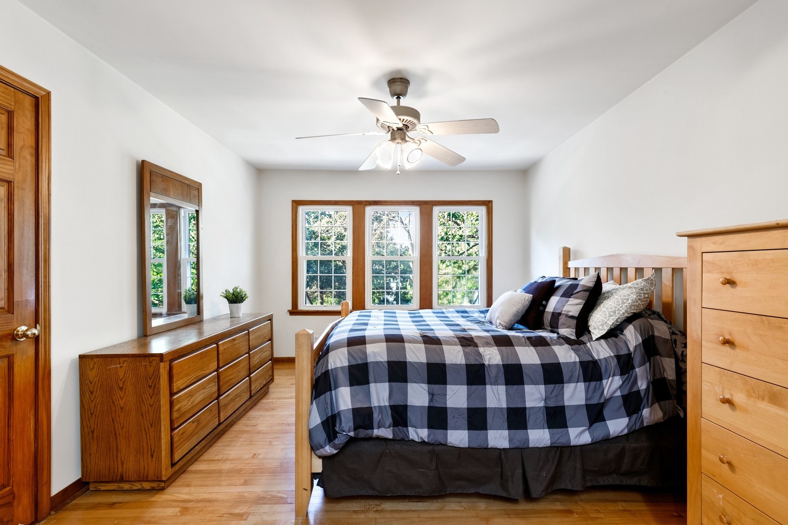 305 Olmsted Road Riverside, IL 60546 - Photo 17 of 33 a bedroom with a bed and wooden floor