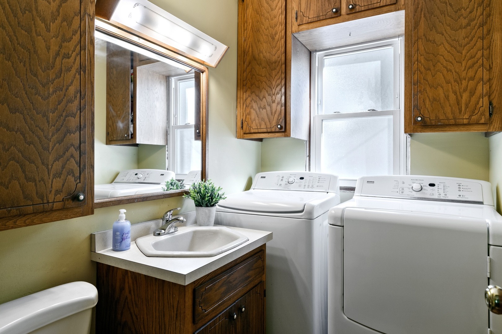 305 Olmsted Road Riverside, IL 60546 - Photo 23 of 33 a bathroom with a sink and a toilet