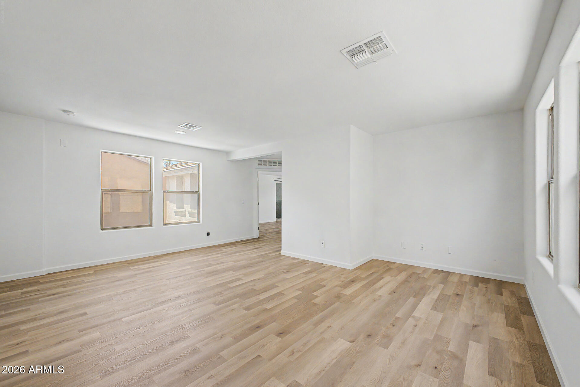 6452 West Ruth Avenue Glendale, AZ 85302 - Photo 18 of 35 a view of empty room with wooden floor and fan