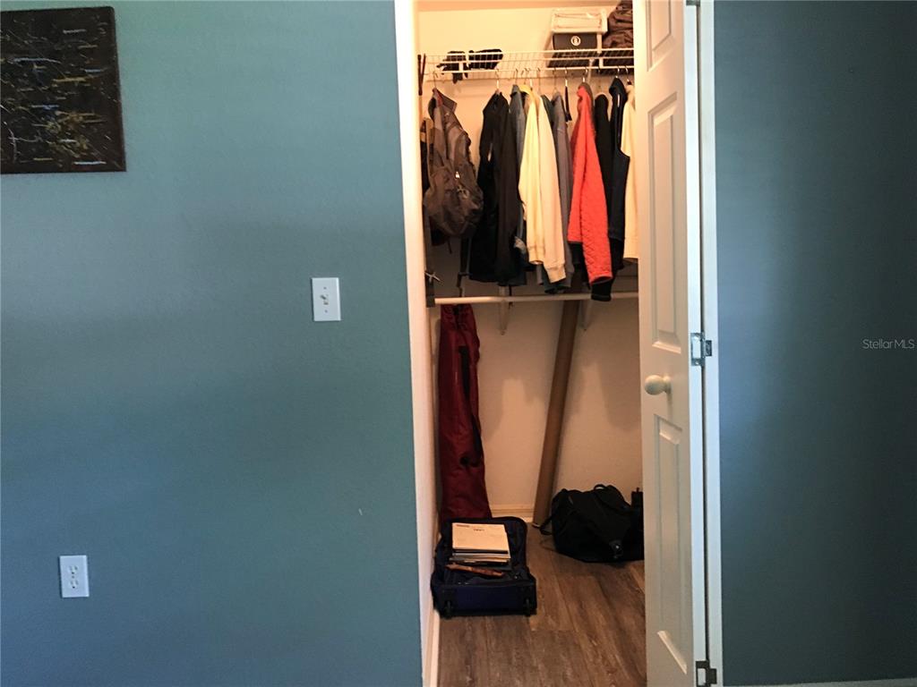 11879 Southwest 137th Loop Dunnellon, FL 34432 - Photo 19 of 37 a view of walk in closet with clothes
