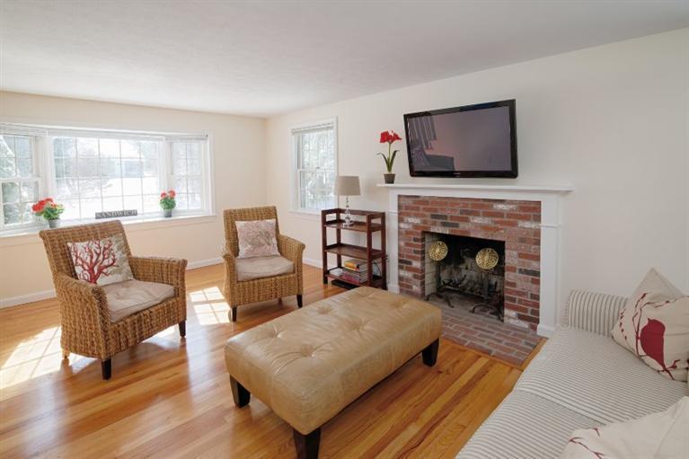 47 Sandy Neck Road East Sandwich, MA 02537 - Photo 4 of 35 a living room with furniture and a fireplace
