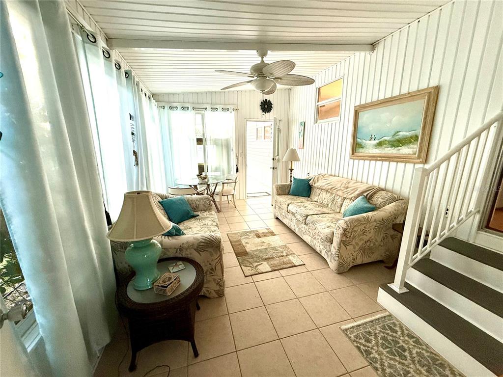 6091 Peony Road Venice, FL 34293 - Photo 5 of 12 a living room with furniture and a large window