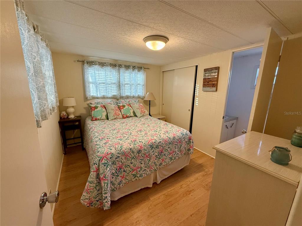 6091 Peony Road Venice, FL 34293 - Photo 8 of 12 a bedroom with a bed and a table