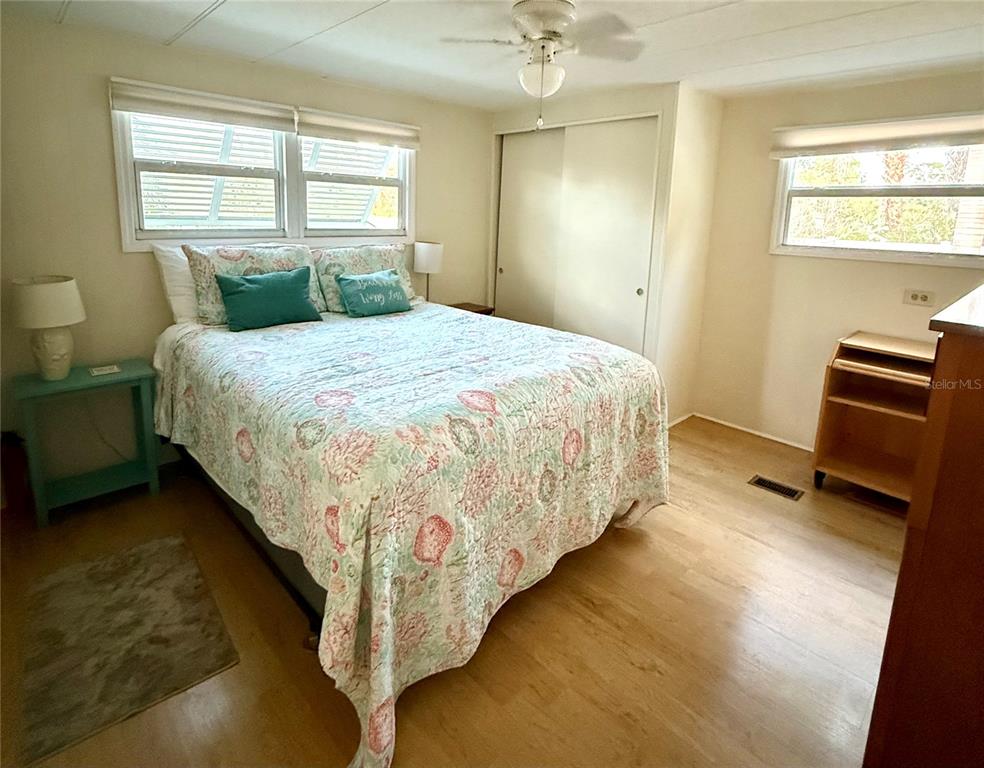 6091 Peony Road Venice, FL 34293 - Photo 9 of 12 a bedroom with bed and window