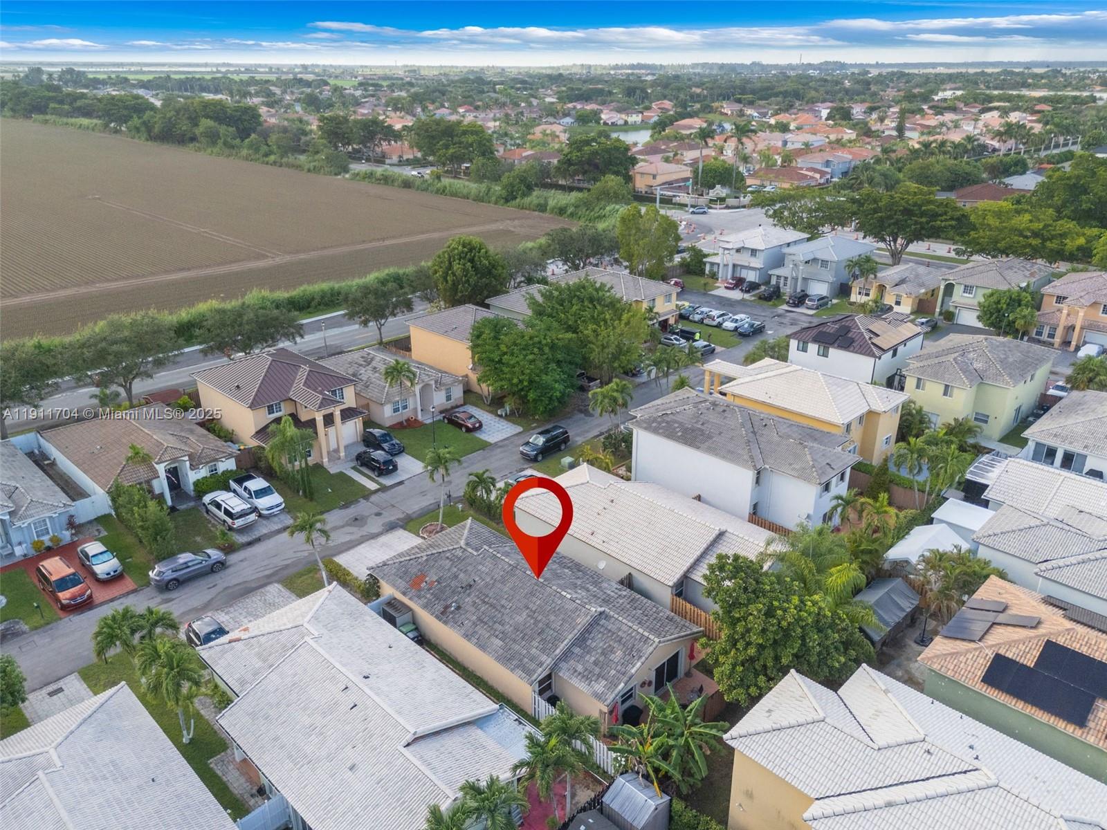 10523 Southwest 161st Place Miami, FL 33196 - Photo 25 of 26 an aerial view of residential houses with outdoor space