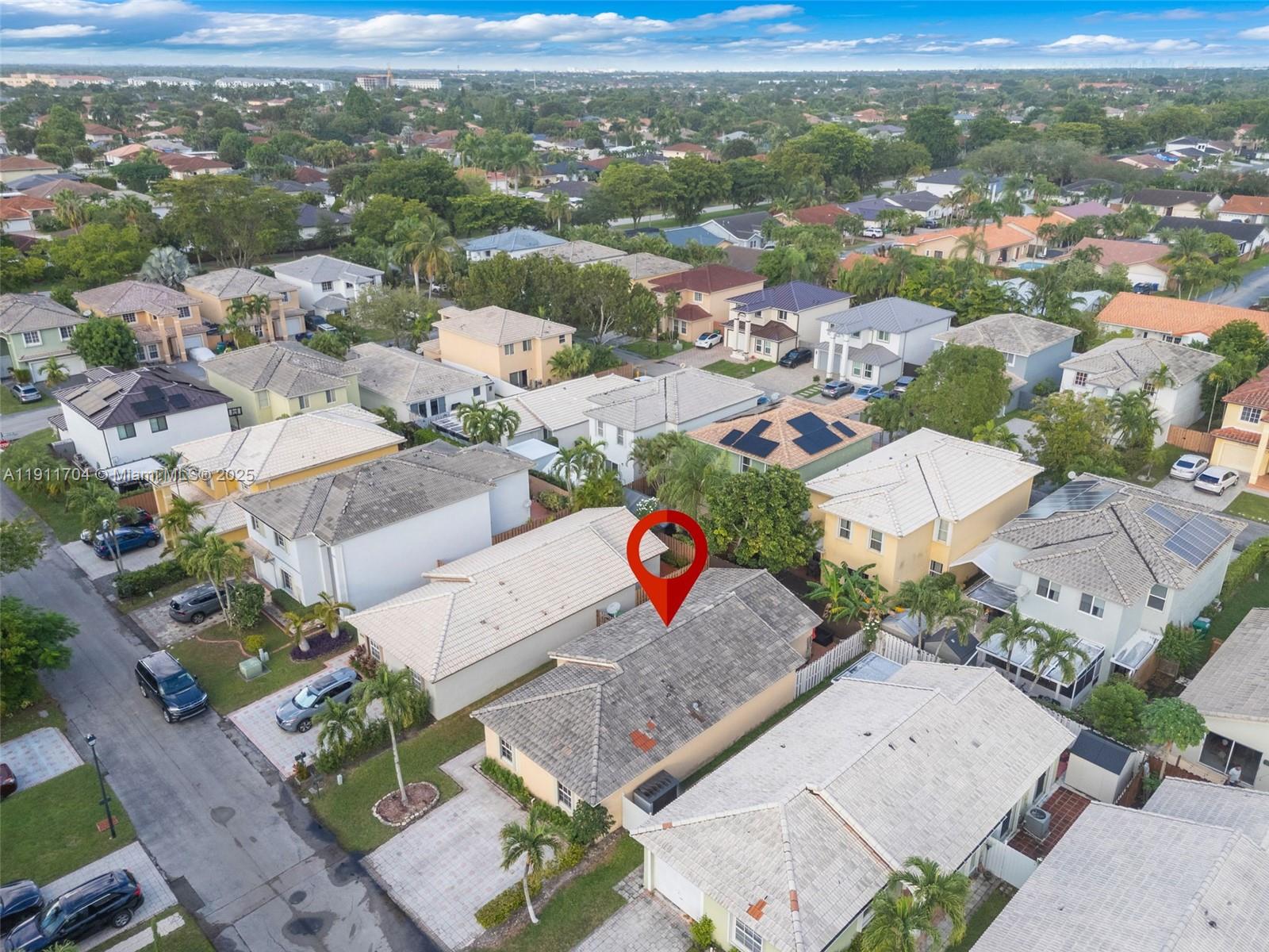 10523 Southwest 161st Place Miami, FL 33196 - Photo 26 of 26 an aerial view of a city with lots of residential buildings