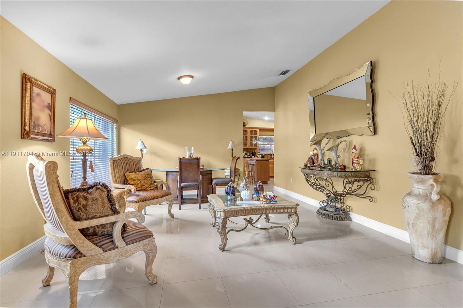 10523 Southwest 161st Place Miami, FL 33196 - Photo 3 of 26 a living room with furniture and a table