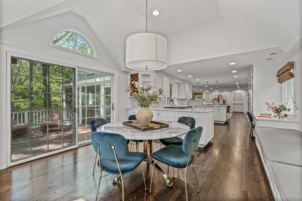 255 Westerly Road Weston, MA 02493 - Photo 14 of 35 a dining room with furniture a window and a chandelier