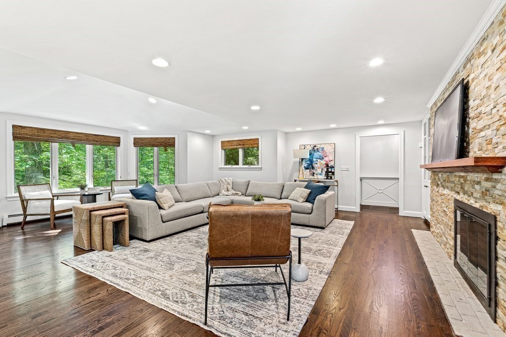 255 Westerly Road Weston, MA 02493 - Photo 18 of 35 a living room with furniture and a fireplace