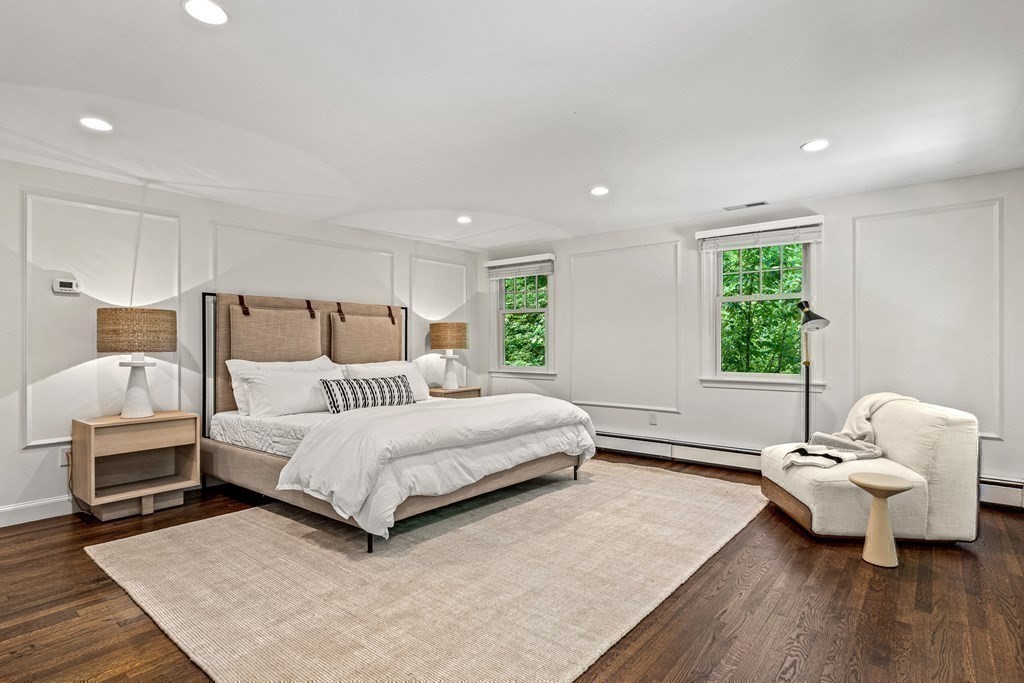 255 Westerly Road Weston, MA 02493 - Photo 22 of 35 a spacious bedroom with a bed and a couch