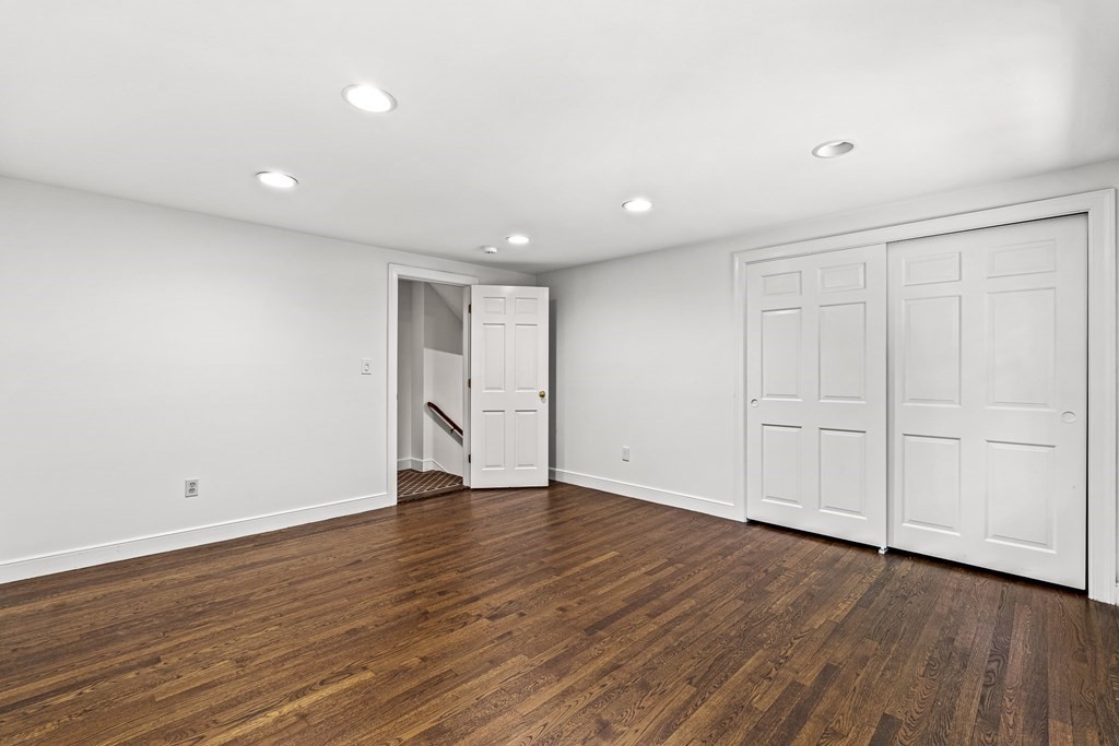 255 Westerly Road Weston, MA 02493 - Photo 25 of 35 a view of an empty room with wooden floor