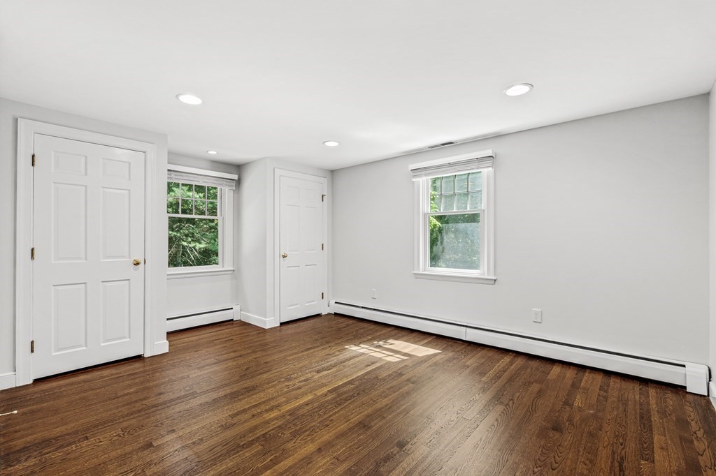 255 Westerly Road Weston, MA 02493 - Photo 26 of 35 an empty room with wooden floor and windows