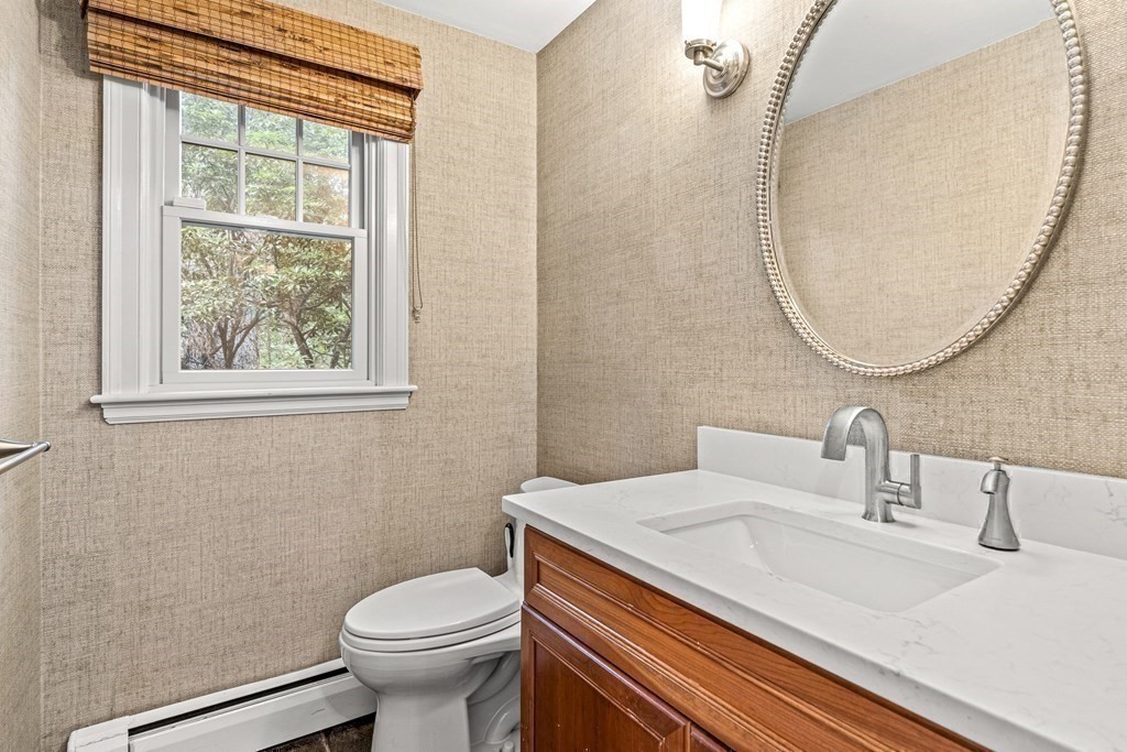 255 Westerly Road Weston, MA 02493 - Photo 28 of 35 a bathroom with a sink a toilet and a mirror