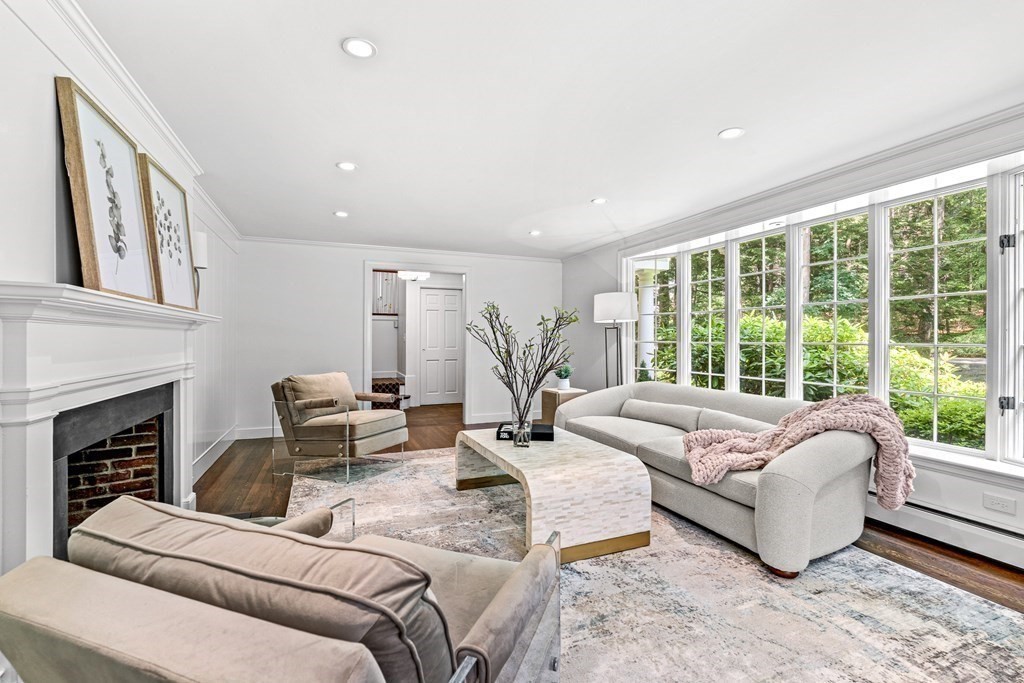 255 Westerly Road Weston, MA 02493 - Photo 5 of 35 a living room with furniture large window and a fireplace