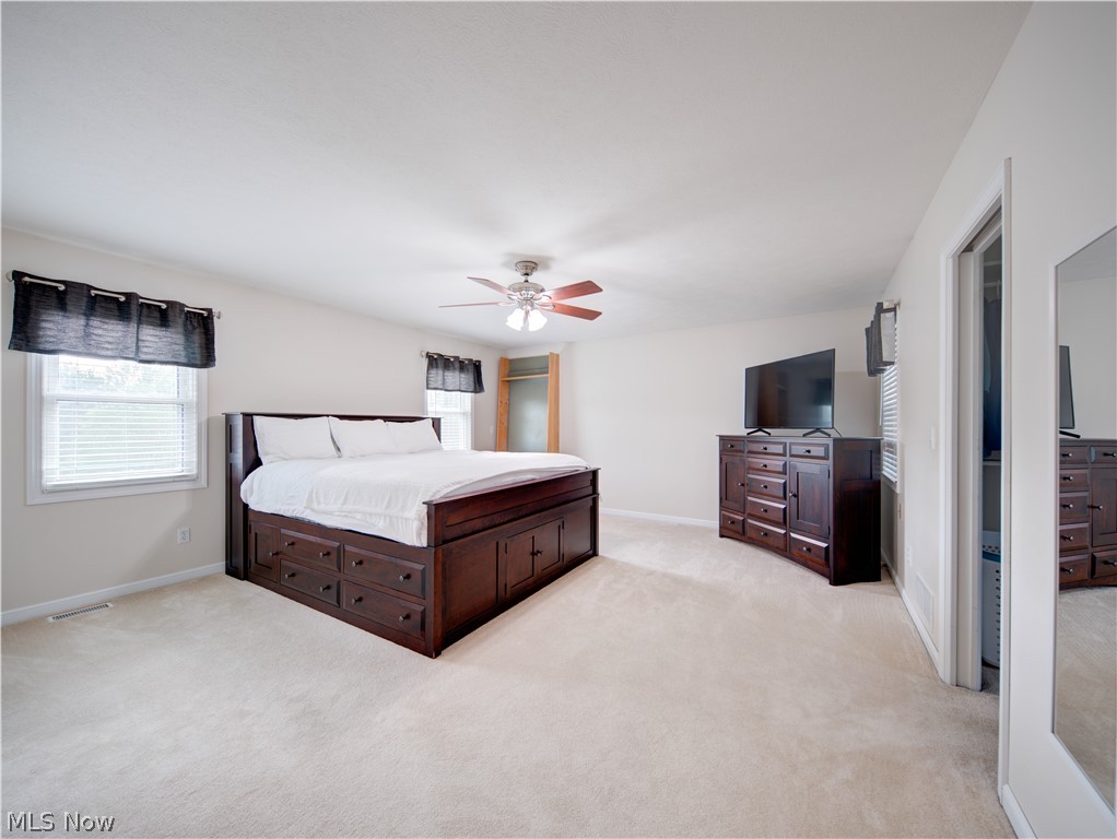9900 Mentor Road Chardon, OH 44024 - Photo 39 of 49 Bedroom featuring light colored carpet and ceiling fan