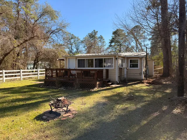 a view of a house with pool in front of it