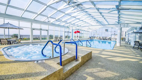 a view of a swimming pool with a patio