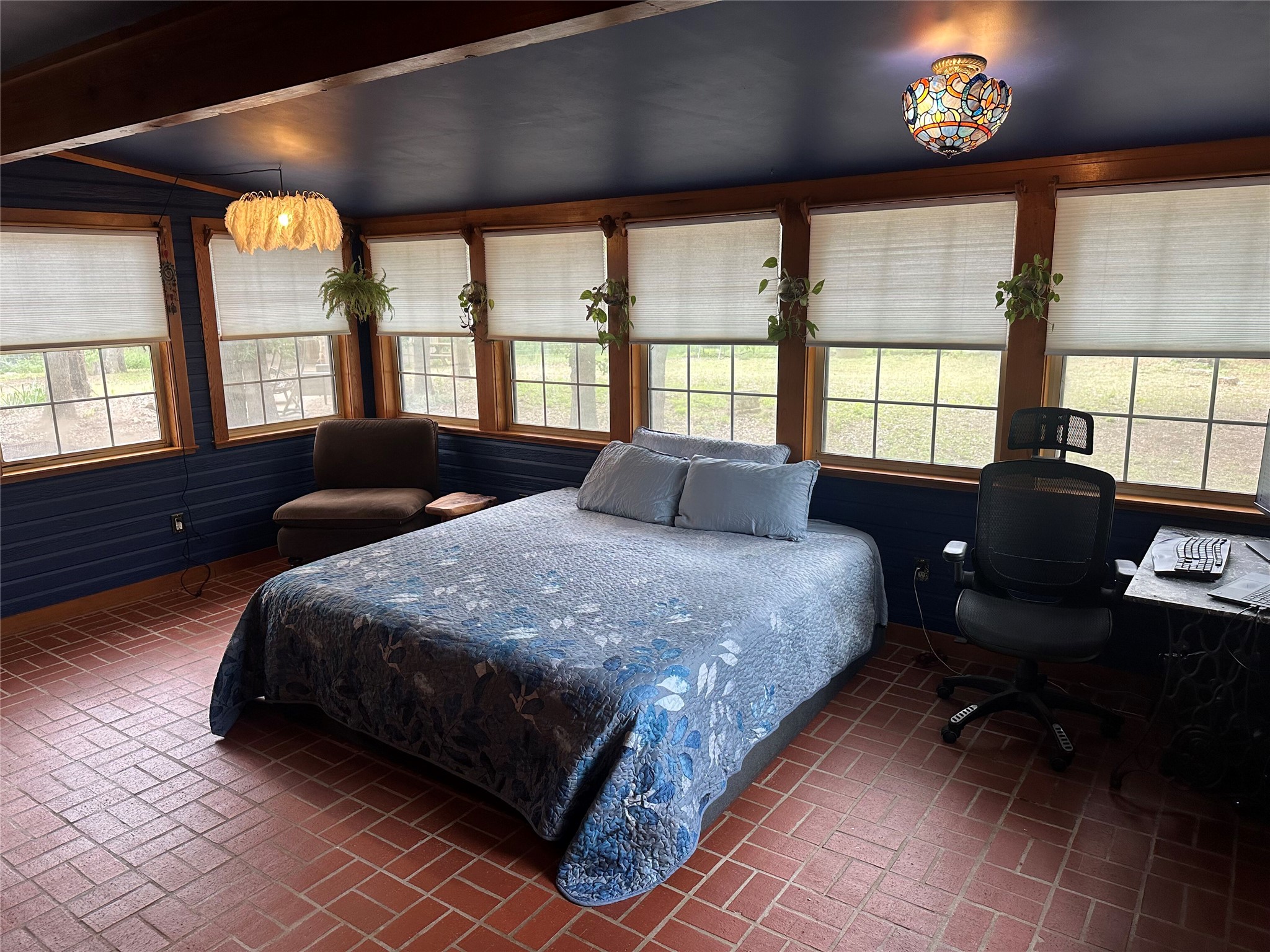 1053 East County Rd F Lexington, TX 78947 - Photo 13 of 38 a spacious bedroom with a bed and a large window