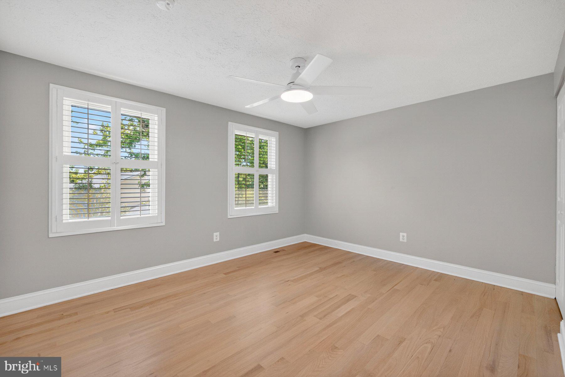 7518 Candytuft Court Springfield, VA 22153 - Photo 25 of 47 an empty room with wooden floor and windows
