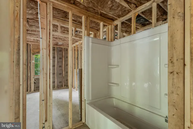 a view of a bathroom with a glass door shower