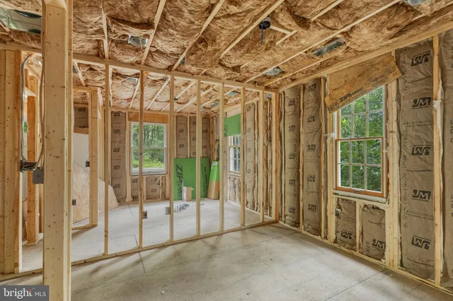 a bathroom with a shower and mirror