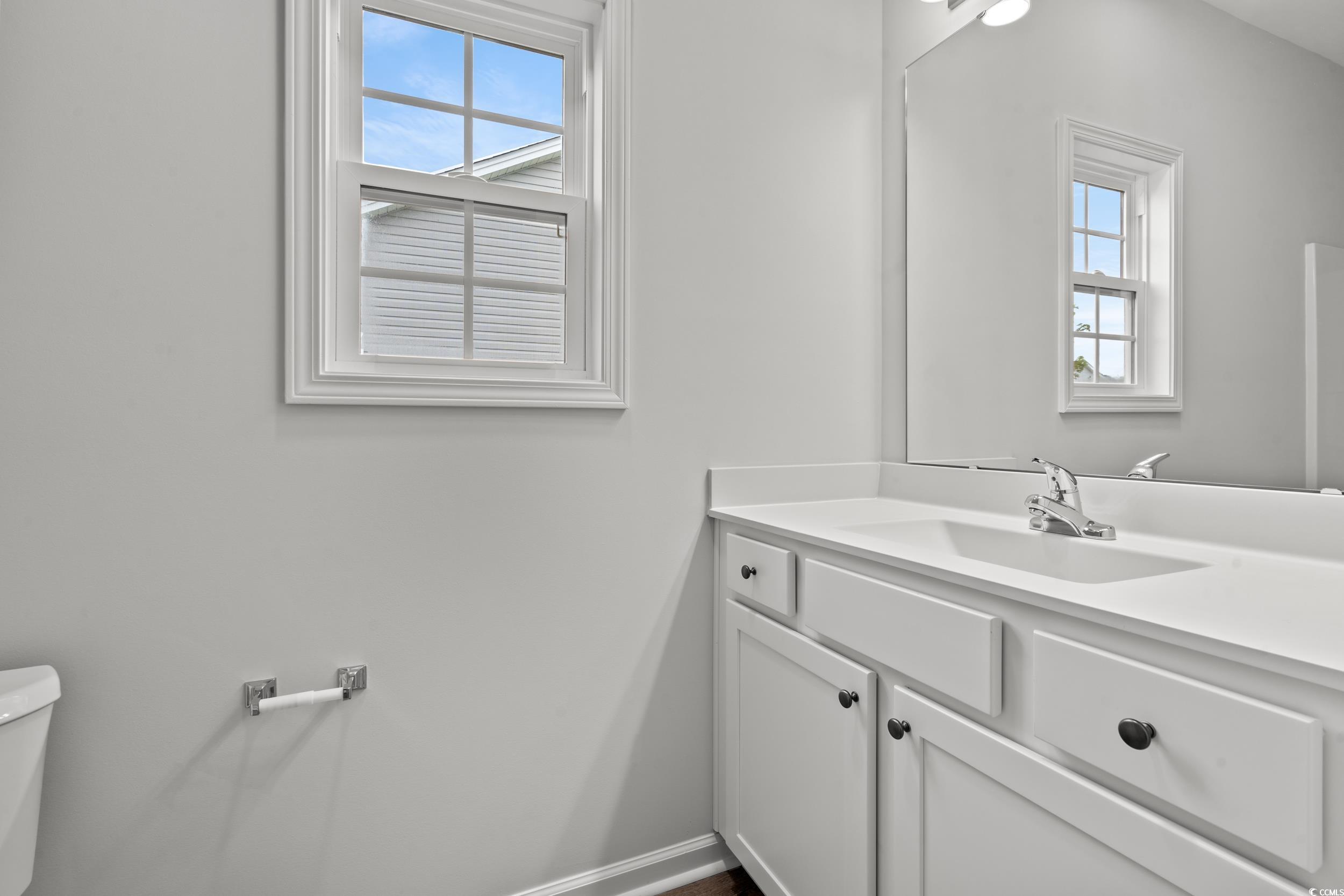 267 Stillbrook Drive Longs, SC 29568 - Photo 13 of 37 Half bathroom featuring vanity and toilet