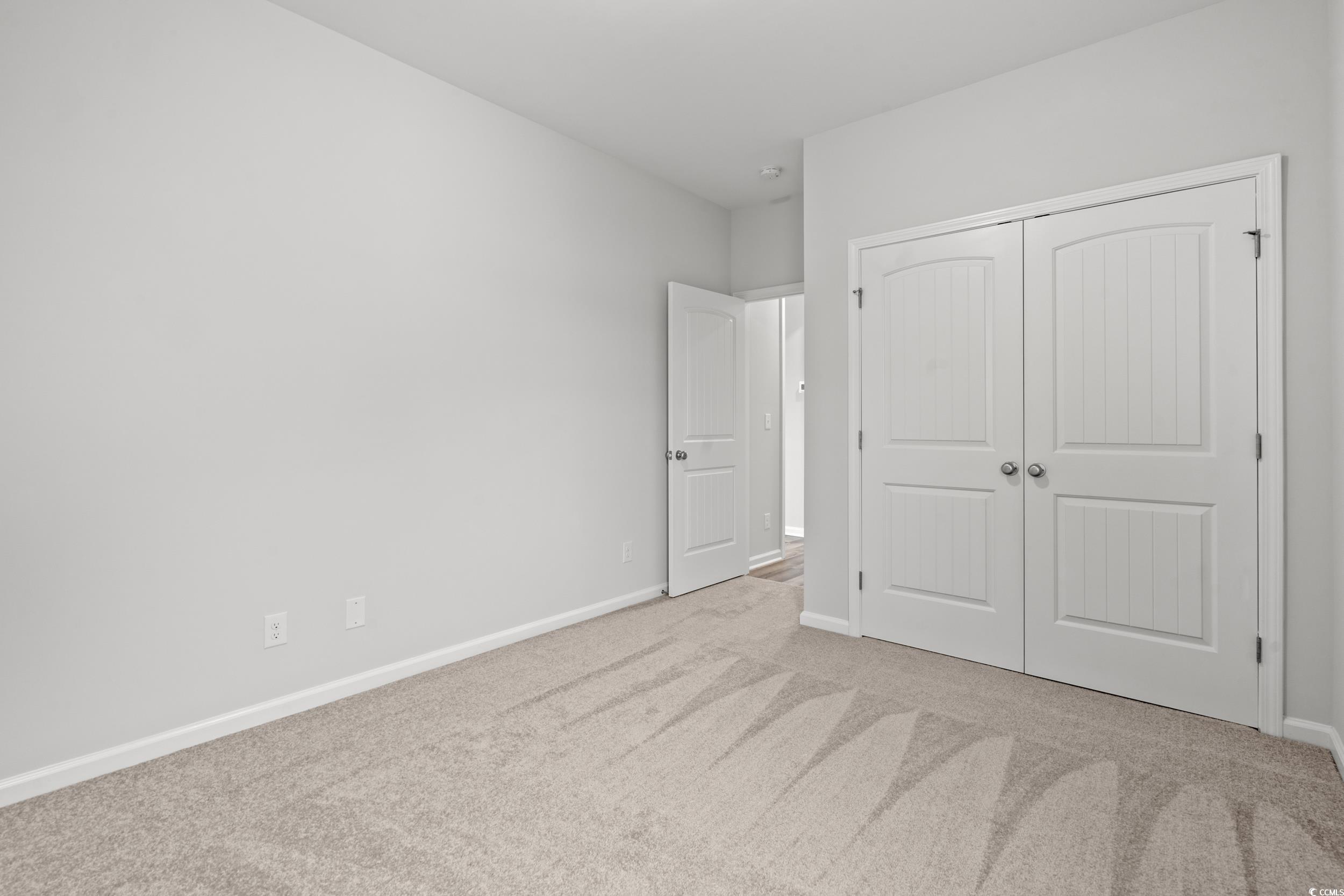 267 Stillbrook Drive Longs, SC 29568 - Photo 15 of 37 Unfurnished bedroom featuring carpet flooring and a closet