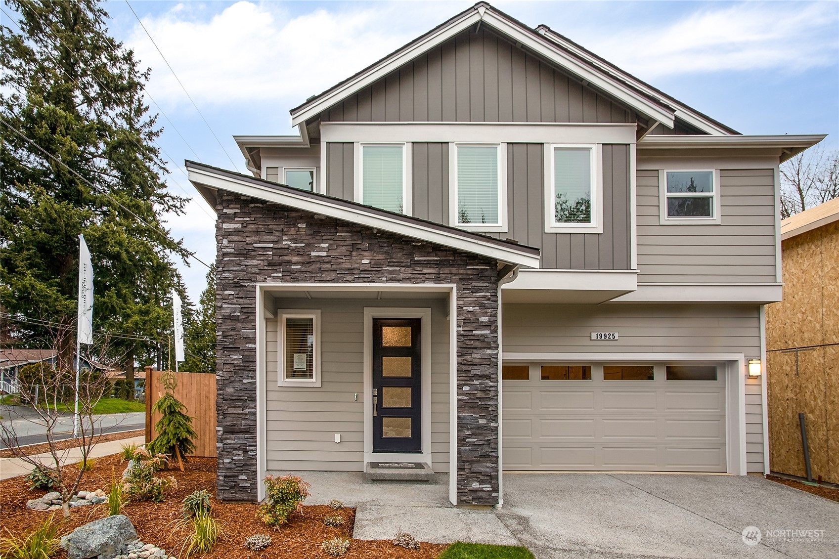 25 178th Place Southwest Bothell, WA 98012 - Photo 1 of 30 a front view of a house with a garage