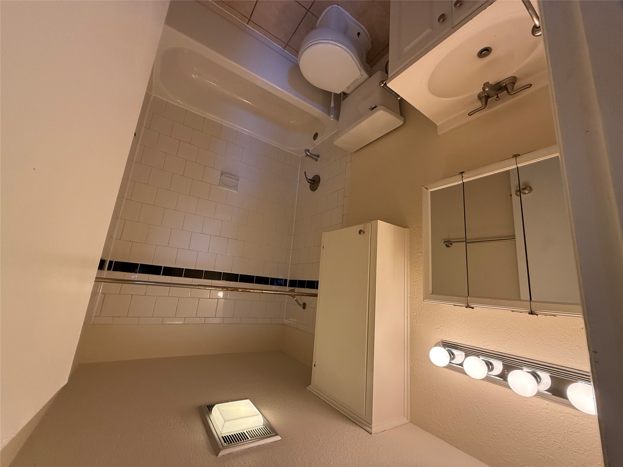 4701 Red River Street, Unit 301 Austin, TX 78751 - Photo 6 of 6 a bathroom with a sink a toilet and shower