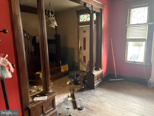 a room with gym equipment and a large window