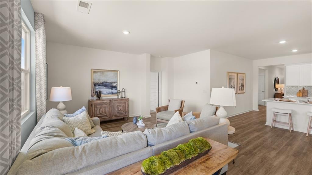 207 Cattle Drive Perry, GA 31069 - Photo 16 of 52 a living room with furniture and a wooden floor