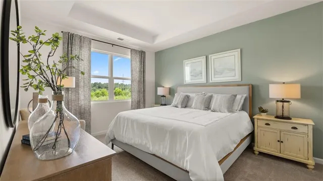 a bed room with a bed and a window