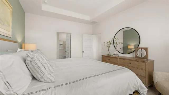 a bathroom with a double vanity sink a mirror a bathtub and shower